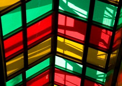 light shining through colourful glass roof panels