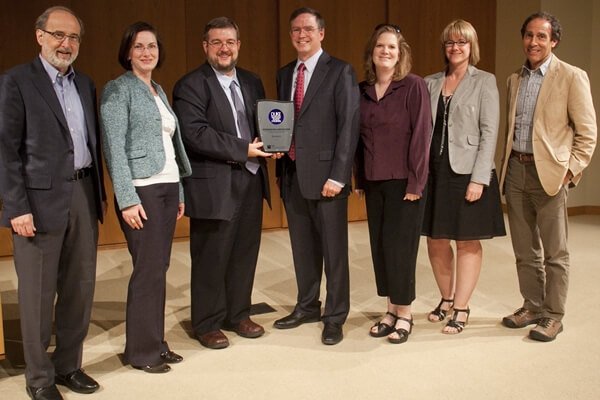Jim Fruchterman is presented with a CASE award Jim Fruchterman is presented with a CASE award